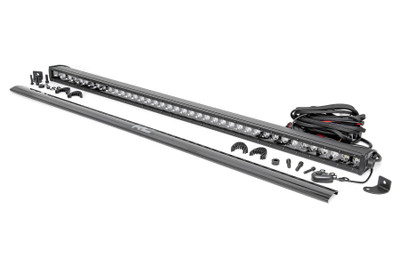 Command the Dark: Light up the night and stay on the trails longer with Rough Country's sleek 40-inch Single Row CREE LED Light Bar. This powerful light bar offers 16,000 lumens of illumination and 200 watts of energy-efficient output, all housed in a stylish, modern frame. Featuring 40 high-intensity 5-watt CREE LEDs, it delivers superior brightness and durability for any adventure.The sleek black panel design complements vehicles with black accents, such as grilles, wheels, bull bars, or steps. Designed for all-weather performance, this light bar comes with a durable die-cast aluminum housing, ensuring maximum strength and heat dissipation. ItΓÇÖs also backed by an IP67 waterproof rating, providing reliable performance even in harsh conditions.Installation is made simple with the included premium, flat-wound wiring harness, complete with an on/off switch for easy operation. The light bar also features Rough Country's Light Bar Noise Silencers, designed to eliminate unwanted hums, whistles, and wind noise typically found in mounted LED light bars.This light bar includes both end mounts and adjustable base mounts, offering multiple mounting options for maximum versatility. A snap-on cover protects the lens, while Moisture Breather technology reduces moisture build-up inside the light. Plus, itΓÇÖs all backed by a 3-year warranty for peace of mind.