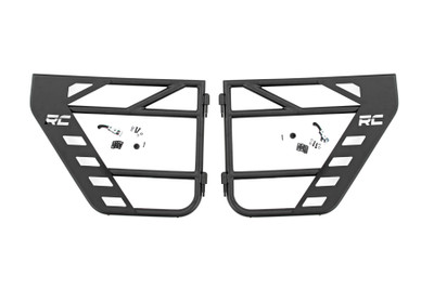 Put the wind in your hair and freedom at your fingertips with Rough CountryΓÇÖs Steel Tube Doors! These durable, steel doors give your vehicle an aggressive look while giving you increased visibility without sacrificing safety.ThereΓÇÖs little in this world that can match the feeling of riding in a Jeep with nothing between you and the world around you! Rough CountryΓÇÖs easy-to-install tubular steel doors allow you to keep your occupants safe while enjoying the open air. These durable, 1.25in diameter tube steel doors with integrated latching system keep everyone contained and comfortable for the duration of the journey. Rough CountryΓÇÖs Tube Doors feature a high-quality, black powder coat thatΓÇÖs designed to resist corrosion for a long lifespan of good looks. The simple bolt-on installation process makes them easy to install, allowing for a total transformation of your Jeep in no-time flat! Each front tube door Includes a mounting point to attach the factory mirrors. \
\