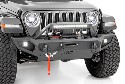 Transform the look and capabilities of your Jeep with Rough CountryΓÇÖs Full Width Trail Bumper. This full-width version of our fan-favorite Stubby Trail Bumper includes a few extra features youΓÇÖre sure to enjoy!\
Rough CountryΓÇÖs Jeep LED Trail Bumper has been engineered with a full-width design that fits in nicely with the factory flare or aftermarket modifications. With Jeep adding turn signals to the factory flares on JL and JT models, a full-width bumper can help lend an aggressive off-road look to your Jeep even when retaining the factory flare.\
Each kit includes a modular integrated fog light mount that allows you to run the included Rough Country 2-inch flush-mount led cubes. This front bumper also features a built-in Rough Country 20in Single-Row Black-Series LED Light Bar, providing 7,200 lumens and 100 watts of forward-facing illumination to help you easily see the trail ahead.\
Rough CountryΓÇÖs Full-Width Trail Bumper also features a set of D-ring shackles for a convenient recovery point, as well as a winch plate allowing you to install any standard-sized winch. A protective skid plate ensures unbeatable protection in off-road environments. If youΓÇÖre looking for one of the best Jeep bumpers available, look no further!