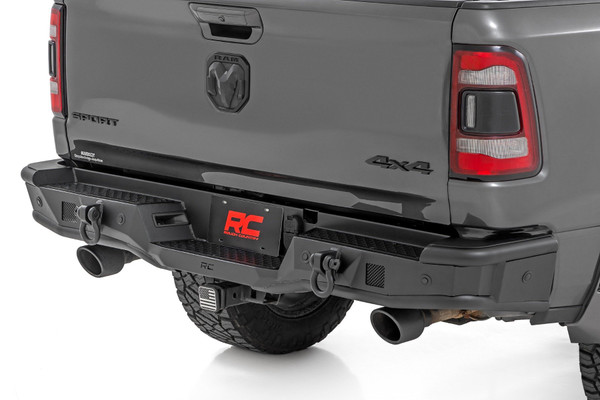 Rugged Rear-End Upgrade: Transform the rear of your fifth-generation Ram 1500 with Rough Country's Tubular Rear LED Bumper. This aggressive, high-clearance design not only elevates your truck's off-road appearance but also improves departure angles for trail-ready performance. Whether you're crawling rocky terrain or cruising city streets, this bumper delivers head-turning style and rock-solid protection.Engineered for Strength and Function: Crafted from heavy-duty steel and finished in a corrosion-resistant, textured black powder coat, this bumper is built to handle whatever the road or trail throws your way. Its bold tubular design complements your Ram's body lines while providing dependable impact resistance and long-lasting durability.Fully Compatible and Sensor-Ready: This rear bumper is designed to retain your factory receiver hitch for full towing functionality and accommodates factory backup and proximity sensors. For Ram 1500 models not equipped with sensors, mesh block-off plates are included to maintain a clean, finished look.Light-Ready Design: Need extra visibility? This bumper includes provisions to mount Rough Country's 2-inch LED light cubes, giving you the ability to add powerful rear-facing illumination for trail spotting, worksite visibility, or night-time reversing.Hassle-Free Installation: No cutting, welding, or drilling required. This bumper features a 100% bolt-on installation using standard tools and can be completed in just 3-4 hours from the comfort of your garage.Backed by a Limited Lifetime Warranty: Rough Country backs this rear bumper with a limited lifetime replacement warranty against structural and workmanship defects, giving you confidence on every adventure.
