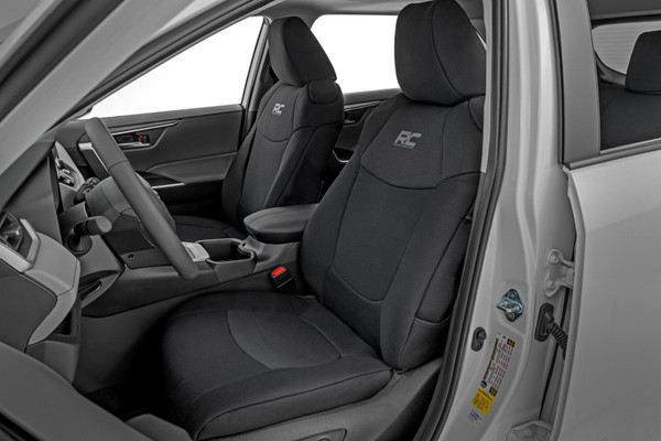 Looking to preserve your Toyota RAV4's interior or refresh seats that are starting to show their age? Rough Country's Neoprene Seat Covers are the perfect solution to protect against stains, spills, and wear, while giving your cabin a like-new appearance.Custom-Fit for Your RAV4: These seat covers are precision-crafted to factory specifications, delivering a snug, secure fit that looks and feels like a natural extension of your interior.Premium 4-Layer Construction: Built with a robust four-layer design, including foam padding and a protective polyester shell, these covers add comfort while defending against daily wear and tear.Neoprene Performance: A breathable, water-resistant neoprene layer provides protection from moisture, sweat, and accidental spills, perfect for commuters, adventurers, and families alike.Full Front and Rear Protection: Each set includes complete front seat coverage with headrest covers where applicable, plus rear seat covers to shield against messes from kids, pets, and cargo.Enhanced Interior Longevity: Guard your most-used seats against fading, stains, and abrasion, keeping your RAV4's interior looking cleaner, longer.Easy Maintenance: Designed with easy-care materials that wipe clean, making upkeep simple and stress-free.Backed by a 2-Year Warranty: Buy with confidence knowing your seat covers are supported by Rough Country's two-year warranty for durability and performance you can trust.Upgrade your RAV4's interior today with Rough Country Neoprene Seat Covers, where protection meets style, mile after mile.