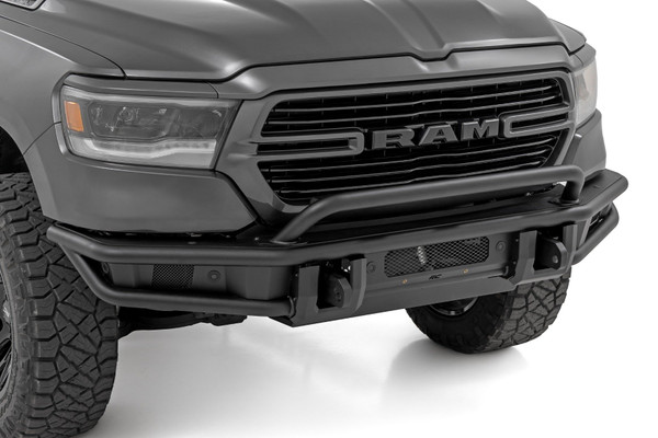 Take your truck's off-road capability and style to the next level with this rugged, trail-ready upgrade. Built for performance and designed to turn heads, this bumper is ready for any adventure.Sleek & Bold Design: Constructed with durable 2-inch diameter tubing and finished in a corrosion-resistant Satin Black coating, this bumper delivers a bold, aggressive look that complements your Ram 1500's rugged stance.Trail-Ready Strength: Equipped with a heavy-duty D-ring set boasting a massive 4.75-ton capacity, this bumper provides reliable recovery points for your toughest adventures.Ultimate Off-Road Protection: An integrated skid plate shields vital components from rocks, debris, and rough terrain, while the bolt-on stinger bar enhances front-end protection and style.Built-In Light Bar Mount: The stinger bar isn't just for protection - it also functions as a sturdy mount for an LED light bar, giving you the flexibility to enhance nighttime visibility on the trails.With bold styling, unbeatable strength, and essential off-road features, Rough Country's Front Tubular Bumper is the game-changing upgrade your Ram 1500 deserves. Ditch the stock look and conquer the trails with confidence!