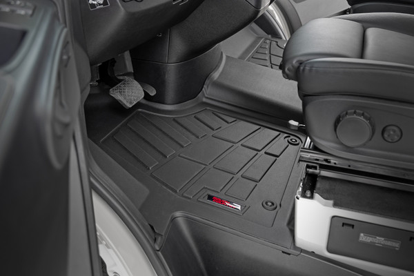Keeping your ride spotless isn't always easy, especially with the unpredictable weather and accidental spills. Now you can ditch the dirt and keep your ride clean with Rough Country's Sure-Fit Floor Mats! All-Weather Protection: Our Sure-Fit Floor Mats are built to conquer any mess, from snow and mud to sand, salt water, and even that mystery puddle you're too afraid to touch. Spilled coffee? Don't sweat it! These mats feature a raised lip design that traps spills before they can reach your carpet. Plus, the textured surface keeps your feet firmly planted (no matter how messy things get).Sure-Fit Design: Made from tough Thermoplastic Rubber, these mats can handle anything you throw at them. They're flexible enough to contour perfectly to your Mercedes-Benz Sprinter Van's floor, but strong enough to withstand even the most extreme temperatures. And the best part? They're custom-designed for your ride, so you get a perfect fit with extra coverage, whether you're rocking bucket or bench seats.Installation is a Breeze: Simply swap out your old mats and put ours in place. And they're just as easy to remove for cleaning, whether you're hitting them with the hose or giving them a quick vacuum. Made with pride in the USA using high-quality materials, they're built to withstand the test of time. And to show we stand behind our product, we offer a Limited Lifetime Warranty, so you can drive with confidence knowing your investment is protected.With Rough Country's Sure Fit Floor Mats you get the perfect combination of style, durability, and peace of mind, knowing your vehicle's floors are protected no matter where the road takes you. Life is messy, but your truck doesn't have to be.