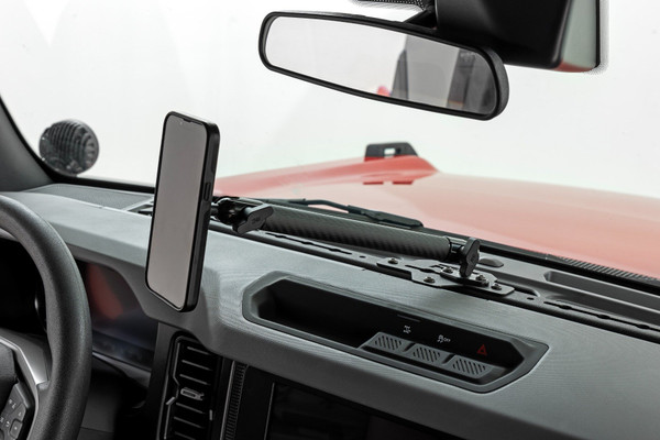 Rough CountryΓÇÖs Bronco Dash Mount puts an end to those awkward scrambles by keeping your phone right where it belongsΓÇösecure, visible, and easy to grab. Designed for easy access and a clean, organized dash, this mount makes it easy to keep your eyes on the road while your device stays put.Easy Access to Your Phone: No more digging around or struggling to find your phone. With this dash mount, your device is always within easy reach, whether youΓÇÖre navigating rough terrain or stuck in traffic.Clear the Clutter: Give your Bronco a clean, organized look by keeping your phone off the seats and out of the cup holders. This mount helps you stay tidy and keeps your essentials where they should be.Tough as Nails: Made from 14-gauge powder-coated steel, this mount is built to handle any off-road adventure or daily drive with ease. Durable, rugged, and ready for anything.100% Bolt-On Installation: Easy installation means you can get it done in minutes. Just bolt it on, and youΓÇÖre good to go. No drilling, no extra hardware, no worries.From back roads to city streets, the Rough Country Bronco Dash Mount keeps your device locked in place, leaving you free to focus on the drive.