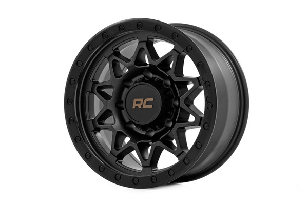 Take your off-road rig to the next level with a wheel designed for adventure and built to perform. The Rough Country 78 Series wheel combines bold aesthetics with rugged functionality, making it the ultimate choice for off-road enthusiasts.Aggressive Semi Gloss Black Finish: Perfectly complements the tough, trail-ready look of your vehicle.Simulated Beadlock Design: Gives your rig that hardcore off-road styling while maintaining easy installation.Unmatched Strength & Lightweight Performance: Precision-engineered from a single piece of premium aluminum for unbeatable durability without adding extra weight.Premium Details: Includes a Rough Country black center cap with standout bronze lettering for a clean, custom touch.Trail-Tested Durability: Backed by a 1-year finish warranty and a Limited Lifetime Structural Warranty to handle whatever the trails throw your way.Whether you're tackling rugged terrain or just want to stand out from the crowd, these wheels are built to deliver. Gear up and conquer the trails in style with Rough Country!