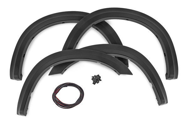 Style and Protection. Unlock the power of real protection and custom style with Rough Country's Sport Style Fender Flares for your fifth-generation Ram 2500/3500! Offering 5 inches of Flare Height, you know your truck is getting the coverage it needs from flying debris and road grime. Not only will these flares safeguard your vehicle, but they will look great too - featuring a bold custom look that stands out and turns heads. Plus, if you want to take your customization game up a notch, these fender flares are easily paintable so they can match your truck in color and style. Get ready to rock this new rugged look ΓÇô with Rough Country's Sport Style Fender Flares!\
Sturdy Construction. These bold and rugged fender flares are designed exclusively for Ram 2500/3500 owners, creating an instant upgrade for your ride. Made from a special Tri-Blend ABS material, these flares have maximum strength and durability, ensuring they will stand up to the toughest conditions that nature has to offer. For added protection, each fender is machine-formed to exact specifications with a high-grade UV protection. Not only do these fender flares look great, but you can trust that they will hold up and continue looking fresh despite the elements.\
Installation and Warranty. Featuring an easy and quick installation process, these flares have been designed to provide your truck with the stylish look you've been searching for without any of the hassle. Plus, if you need to bring your truck back to its original specs, the flares can be removed in a flash! But that's not all ΓÇô each set comes equipped with a three-year limited warranty. Stop dreaming about that showroom-level look and make it happen with Rough Country's Sport Style Fender Flares.