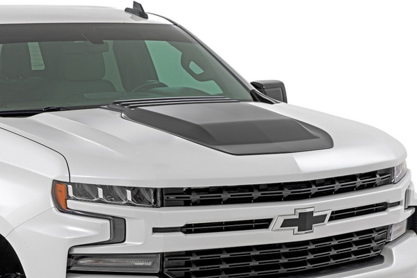 Tired of blending in with the crowd? Your Chevy Silverado 1500 deserves to turn heads and command respect on and off the road. The Rough Country Hood Scoop is the perfect solution to elevate your truckΓÇÖs look from stock to stunning. This hood scoop doesnΓÇÖt just look meanΓÇöitΓÇÖs meticulously engineered to fit your Silverado 1500 like a glove, ensuring that every contour and curve aligns perfectly. This hood scoop is your ticket to a bolder, more impressive look that leaves a lasting impression.Ready for the best part? Installing this bad boy is a breeze! Choose from Matte Black, Gloss Black, or Paint-to-Code to match your truckΓÇÖs vibe. ItΓÇÖs built to withstand whatever Mother Nature throws your way, from dusty desert trails to muddy backwoods adventures. Get your Rough Country Hood Scoop today and give your Silverado the attitude it deserves.