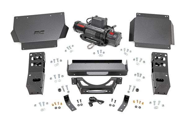 Conquer any challenge on the trail with the fourth-generation Tacoma Hidden Winch Mount by Rough Country. Engineered for seamless integration, this rugged upgrade delivers uncompromising strength, enhanced protection, and a sleek, low-profile design.Stealthy Power: Designed specifically for Rough Country's PRO9500S and PRO12000S winches, this hidden winch mount blends strength with style. Its flat black powder coat finish resists corrosion while maintaining your truck's aggressive look.Heavy-Duty Construction: Built for extreme durability, the 7-gauge steel winch tray and mounts provide rock-solid support, while the 11-gauge steel skid plates offer reinforced undercarriage protection against tough terrain.Maximum Protection: The included differential skid plate shields vital drivetrain components, giving you the confidence to tackle rugged trails without worry. Plus, the front skid plate features a laser-cut Rough Country logo, adding a signature touch of style.Effortless Installation: Hit the trails sooner with a bolt-on structural design that makes installation quick and hassle-free. The bumper wing supports mount directly to factory intrusion bars, ensuring a secure, factory-like fit.The Rough Country Hidden Winch Mount for the 4th Gen Tacoma isn't just an accessory-it's an essential upgrade for serious off-roaders. Whether you're navigating rocky climbs or need extra pulling power, this system delivers the strength, protection, and stealth you need to dominate the trail.