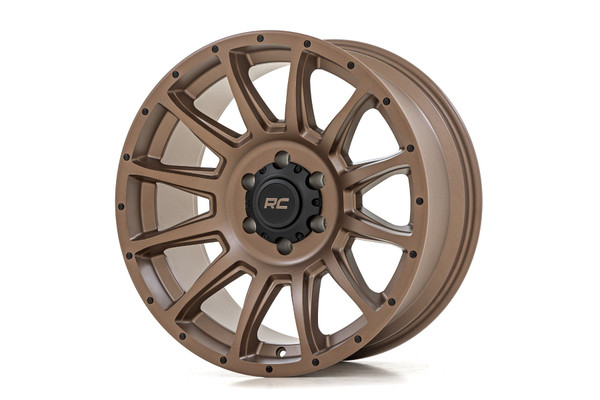 If you've been hitting the trails and feeling like your wheels just aren't cutting it, then itΓÇÖs time to upgrade your wheels.  Designed for hardcore off-roaders and weekend warriors alike, Rough CountryΓÇÖs 90 Series Wheel solves the problem of having to choose between strength, style, and performance. With the 90 Series, you get it all.Distinctive Bronze Finish: Stand out on the trails and turn heads at every stoplight with our eye-catching bronze finish. Not only does it look slick, but itΓÇÖs also built to resist the elements.Single-Piece Aluminum Construction: Engineered with cutting-edge aluminum, the 90 Series boasts an industry-leading strength-to-weight ratio. This translates to a lighter ride for your vehicle and exceptional durability, ensuring you can handle even the most rugged terrain with confidence.Multi-Spoke Design: The sleek multi-spoke design adds a touch of class to your ride and provides superior strength and durability so you can conquer the trails in style without sacrificing performance.Rough Country Black Center Cap: Every wheel includes a Rough Country black center cap, adding a subtle yet bold touch to your setup.Warranty Coverage: Ride with confidence, knowing you're backed by a 1-year finish warranty and a Limited Lifetime Structural Warranty. WeΓÇÖve got your back so you can focus on the adventure ahead.The 90 Series Wheel is more than just a tool for conquering trails. It's a statement of style and a symbol of your off-road prowess. Whether youΓÇÖre navigating rocky terrains or splashing through mud, this wheel is designed to perform and impress. It's time to leave the mundane behind, embrace the thrill of adventure, and transform your ride into an off-road legend.