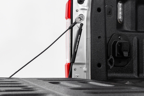 This Assistance You Need. Want a hassle-free way of lowering your tailgate? Look no further than Rough Country's Ford Tailgate Assist! Simply grab and pull the handle, and your gate will ease down, making accessing the back of your truck effortless. With this smooth device, you'll never have to worry about your truck's tailgate slamming down suddenly.  Plus, it provides a safe way to lower your tailgate without straining or using two hands. With Rough Country's revolutionary technology, you can make operating your tailgate as smooth as can be.\
Installation and Warranty. This easy-to-install tailgate assistant works with your factory cables to provide effortless, safe opening and closing ΓÇôgiving you a smooth ride every time. With only one tailgate assist required per truck, you can hit the road and move on in no time. Our Tailgate Assist fits directly onto your driver side without having to drill any holes, and all the hardware you need to install is included in the package. Custom Designed specifically for the Ford Super Duty, Rough Country's Tailgate Assist is back with a three-year warranty!