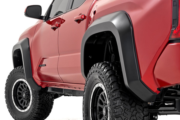 Level up your fourth-generation Tacoma's off-road defense with Rough Country Fender Flares. Stock fenders just don't cut it when you're facing down rocks, mud, and flying debris. These fender flares are engineered to provide serious protection for your truck's paint job, keeping it looking sharp even in the harshest conditions. Here's what makes them a top choice for Tacoma owners:\
Ultra-Durable Tri-Blend ABS Construction:ΓÇ»Stock fenders can't handle the abuse of off-roading. Our Flares are made from revolutionary Tri-Blend ABS, which is ultra-durable and can withstand anything the trails throw your way.\
UV-Protected Against Fading:ΓÇ»UV rays are the enemy of plastic, but not these flares. They're UV-protected to prevent fading and chalking, so they'll stay looking sharp no matter how much sun you see on the trail.\
Customizable Paint Match:ΓÇ»ΓÇ»These Fender Flares come ready to roll with a stylish flat black finish. Don't like flat black? No problem! Paint them to match your truck's color for a seamless look, or choose a contrasting shade for a bold statement.\
Quick and Easy Installation:ΓÇ»Drilling into your truck is a hassle. That's why these flares feature a simple, no-drill installation process. They go on fast and can be easily removed if you ever want to return to the stock look.\
Backed by a 3-Year Warranty:ΓÇ»We're confident in the quality and performance of our Sport Fender Flares, so they're backed by a 3-year warranty, giving you peace of mind on every adventure.