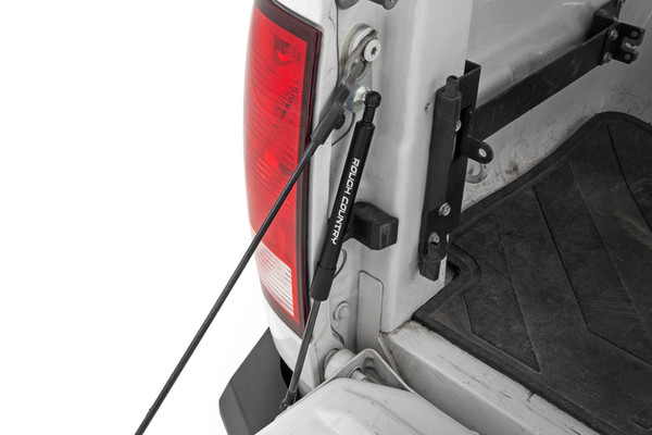 This Assistance You Need. Want a hassle-free way of lowering your tailgate? Look no further than Rough Country's Ram Tailgate Assist! Simply grab and pull the handle, and your gate will ease down, making accessing the back of your truck effortless. With this smooth device, you'll never have to worry about your truck's tailgate slamming down suddenly.  Plus, it provides a safe way to lower your tailgate without straining or using two hands. With Rough Country's revolutionary technology, you can make operating your tailgate as smooth as can be.Installation and Warranty. This easy-to-install tailgate assistant works with your factory cables to provide effortless, safe opening and closing ΓÇôgiving you a smooth ride every time. With only one tailgate assist required per truck, you can hit the road and move on in no time. Our Tailgate Assist fits directly onto your driver side and all the hardware you need to install is included in the package. Custom Designed specifically for Ram truck owners, Rough Country's Tailgate Assist is back with a three-year warranty!