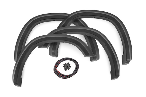 Style and Protection. Unlock the power of real protection and custom style with Rough Country's Sport Style Fender Flares for your fifth-generation Ram 1500! Offering 5 inches of Flare Height, you know your truck is getting the coverage it needs from flying debris and road grime. Not only will these flares safeguard your vehicle, but they will look great too - featuring a bold custom look that stands out and turns heads. Plus, if you want to take your customization game up a notch, these fender flares are easily paintable so they can match your truck in color and style. Get ready to rock this new rugged look ΓÇô with Rough Country's Sport Style Fender Flares!\
Sturdy Construction. These bold and rugged fender flares are designed exclusively for Ram 1500 owners, creating an instant upgrade for your ride. Made from a special Tri-Blend ABS material, these flares have maximum strength and durability, ensuring they will stand up to the toughest conditions that nature has to offer. For added protection, each fender is machine-formed to exact specifications with a high-grade UV protection. Not only do these fender flares look great, but you can trust that they will hold up and continue looking fresh despite the elements.\
Installation and Warranty. Featuring an easy and quick installation process, these flares have been designed to provide your truck with the stylish look you've been searching for without any of the hassle. Plus, if you need to bring your truck back to its original specs, the flares can be removed in a flash! But that's not all ΓÇô each set comes equipped with a three-year limited warranty. Stop dreaming about that showroom-level look and make it happen with Rough Country's Sport Style Fender Flares.