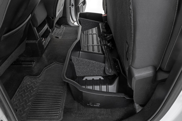 Clean up the contents of your cab with Rough CountryΓÇÖs Custom-Fit Under Seat Storage Compartment. These handy underseat truck storage compartments offer an easy way to store your gear with a custom, contoured look that blends in seamlessly with your vehicleΓÇÖs factory design. Keep your tools, gear, and other odds and ends organized and stowed away while conveniently stowed away under the rear seats.\
Each under-seat storage tray is constructed from a durable, high-density thermoplastic material thatΓÇÖs built to withstand kicks, nicks, and corrosion. A convenient anti-skid surface helps prevent the contents of your underseat cargo tray from rolling around while driving. Best of all, Rough CountryΓÇÖs Custom-Fit Under Seat Storage Compartments are easy to install, so you can upgrade your cargo management quickly and easily!