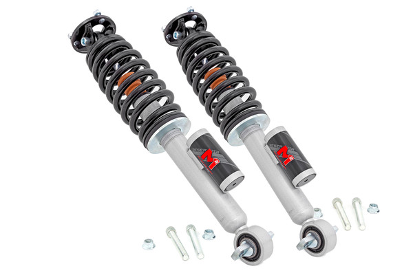 Improved Stance, Balance, and Handling.ΓÇ»If you want to improve your vehicle's on-road performance and off-road capabilities, Rough Country's M1R Struts are the way to go. Our M1R Leveling Struts help stabilize your vehicle's movements, enhancing control when you turn, brake, accelerate, or ride over uneven road surfaces. As an adjustable ride height strut, these M1RΓÇÖs keep your suspension from overextending, providing a more consistent ride. Made for rugged off-road performance, our M1R struts have a 2-inch digressive piston for a more stable ride, preserving the smooth ride quality you need.\
Quality Construction.ΓÇ»Rough Country's M1R Loaded Struts have been engineered to give you the most reliable performance, increased driving comfort, and all-around performance for your vehicle. Made from 2" seamless extruded tubing and features durable vulcanized natural rubber bushings. They're also powder-coated silver for resistance against the elements. Plus, they're adjustable in height. Utilizing multiple grooves in the strut body the spring perch can be raised or lowered. So whether you're looking to add a little extra clearance for off-roading or just want your ride to sit a little higher, our M1R Monotube Reservoir Struts are the perfect solution.\
Installation and Warranty. This bolt-on installation requires just basic tools and about 2-3 hours to complete. Our Strut Kit is backed with a limited lifetime replacement warranty towards manufacturer defects. As such, the product is protected from structural and workmanship damage after the date of purchase. With our industry-leading warranty, give yourself peace of mind when using Rough Country's products!
