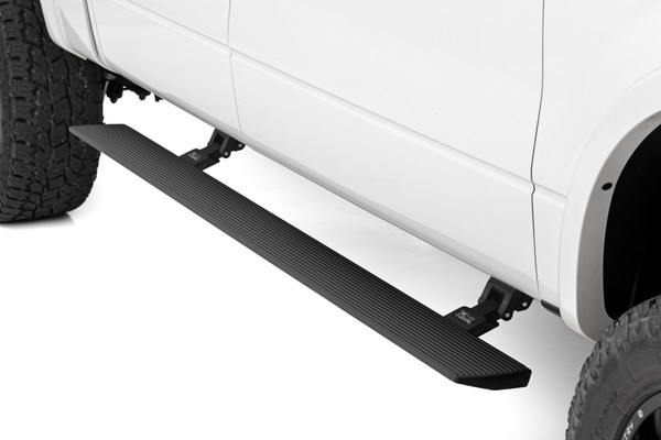 Step up in style.ΓÇ»Sidesteps have come a long way, and now we've taken them to the next level with Rough Country'sΓÇ»Power Running Boards! These retractable E-Boards tuck tightΓÇ»for a clean look when not in use and automatically extend when the door is opened. With an anti-slip surface that provides a secure stepping area, getting in and out of your ride has never been easier.ΓÇ»Our Power Running Boards alsoΓÇ»include LED lights that provide illumination when deployed and shut off when steps are closed, providing a sleek, aerodynamic look.\
ΓÇ»Premium Construction. The Rough Country E-Board Steps combine durability, strength, and style. These 6" all-season steps are made from lightweight yet durable aluminum and can support up to 660 lbs per side. Equipped with dual motor technology, these steps can handle anything Mother Nature throws their way. They feature an automatic 'SAFE-STOP' mechanism that engages if a blockage is detected and include an interior bypass switch for manual override. So whether you're heading out on a weekend errand or loading up for a camping trip, our electric steps offer reliable protection for all your adventures.\
Installation.ΓÇ»These easy-to-install steps are the perfect solution for getting in and out of your vehicle. No drilling is required for installation, and the steps tuck tight under the rocker panelΓÇ»when not in use. Don't struggle to get in and out of your vehicle anymore. Make life easier with Rough Country's Power Running Boards.\
Warranty. Rough Country backs its products with a limited lifetime replacement warranty. Our products are protected from structural and workmanship damage after purchase. Our industry-leading warranty gives you peace of mind when using Rough Country products!