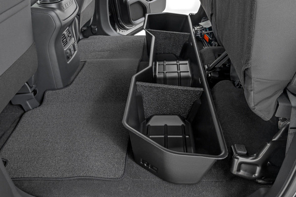 Clean up the contents of your cab with Rough CountryΓÇÖs Custom-Fit Under Seat Storage Compartment. These handy underseat truck storage compartments offer an easy way to store your gear with a custom, contoured look that blends in seamlessly with your vehicleΓÇÖs factory design. Keep your tools, gear, and other odds and ends organized and stowed away while conveniently stowed away under the rear seats.\
Each under-seat storage tray is constructed from a durable, high-density thermoplastic material thatΓÇÖs built to withstand kicks, nicks, and corrosion. A convenient anti-skid surface helps prevent the contents of your underseat cargo tray from rolling around while driving. Best of all, Rough CountryΓÇÖs Custom-Fit Under Seat Storage Compartments are easy to install, so you can upgrade your cargo management quickly and easily!