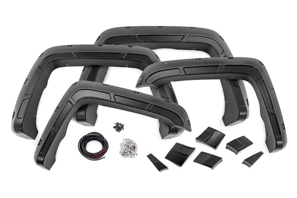 Innovative Design. ItΓÇÖs time to stand out from the crowd and rise above your peers. Increase your truck's tire coverage with Rough Country's Defender Flares for the GMC Sierra 1500/2500HD/3500HD. These aggressively good-looking flares transform your GMC's exterior boasting 2-inches of tire coverage. These uniquely designed flares are sure to protect your GMC's body from mud or road debris kicked up by the tires.\
Durable Construction. With everyday truck drivers in mind, Rough Country designed a Fender Flare that recognizes your expectations for tough tactical design, and your right to demand products with high reliability and outstanding quality. Don't settle for anything less! Rough Country's Defender Flares are designed to handle on or off-road terrain. Rough Country's fender flares are constructed of a smooth ABS UV-protected KoradΓäó plastic. This material is lightweight and can endure the elements. The UV treatment process eliminates chalking and helps prevent sun fading.\
Limited Lifetime Replacement Warranty. Rough Country's Defender Flares are backed with a limited lifetime replacement warranty towards manufacturer defects. As such, the product is protected from structural and workmanship damage after the date of purchase. With our industry-leading warranty give yourself peace of mind when using Rough Country products!