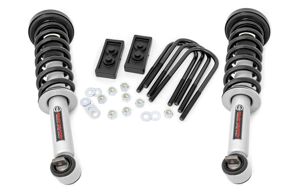 Need a new look?ΓÇ»How can you lift, level, and personalize your truck all at the same time? With Rough Country's 2.5-inch Leveling Kit for your Ford F-150 Tremor! This powerful leveling kit is designed to eliminate the nosediving effect and improve stance and look while retaining ride quality. In addition, our leveling kit offers a boost in ground clearance while allowing you the ability to run 35 x 12.50 tires on OE wheels without any trimming. So, you get a whole new height to look from, along with better undercarriage protection.\
Durability with Style.ΓÇ»Rough Country's F-150 Tremor Leveling Kit consists of Rough Country's N3 Performance Lifted Struts and durable rear blocks. Our Nitrogen charged, loaded struts add ride height to your truck while maintaining a smooth, factory-like ride. Each strut includes a pre-loaded coil for lightning-fast installation without the need for complicated strut disassembly. Each strut also features a silver powder coat finish for a rugged style and durable performance. This kit raises the front of the vehicle 2.5-inches, and the factory rear blocks are replaced with our heavy-duty proprietary composite material blocks to achieve a level stance, providing a perfect balance between appearance and functionality.\
Installation and Warranty. Our 2.5in Leveling Kit for your Ford F-150 Tremor is an easy, bolt-on installation. The kit comes with Rough Country's industry-leading limited lifetime warranty.