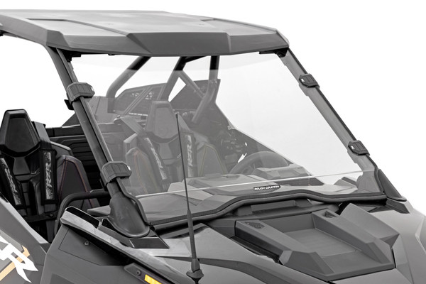 Added Protection and comfortability. Protect the occupants of your Polaris RZR from off-road hazards such as rocks, branches, and other debris with Rough Country's Scratch-Resistant Windshields. UTV Windshields offer a clear visual of the trail ahead and allow for a much more comfortable outing!\
High-Quality Polycarbonate Construction. Rough Country UTV windshields are constructed from thick polycarbonate material that is precision cut for a perfect fit. ┬áThe polycarbonate material provides an ideal combination of clarity, flexibility, durability that outperforms glass, acrylic, and other windshield materials.┬á\
Durable Scratch and UV Resistance. Each windshield is not only constructed from thick polycarbonate material but enhanced by a secondary AR2 hard-coating process.┬á This process completely coats the windshield with a hardened, scratch-resistant barrier.┬á This treatment also provides the additional benefit of UV protection.\
Easy Installation.┬áWith a simple strap-on installation process, installing a Rough Country windshield couldn't be easier.┬á Within 15 ΓÇô 30 mins you can be ready to hit the trails. ┬á\
Limited-Lifetime Replacement Warranty. Rough Country's Scratch-Resistant Windshields are backed with a limited lifetime replacement warranty towards manufacturer defects. As such, the product is protected from structural and workmanship damage after the date of purchase. With our industry-leading warranty give yourself peace of mind when using Rough Country's Suspension products!