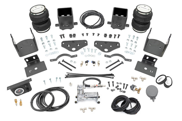 Ideal Leveling: Is your truck your workhorse? The main attraction of a pickup is the ability to haul and tow as needed. However, due to the weight in the bed or the condition of the rear leaf springs, your vehicle may become un-level under load. At Rough Country, we've designed a solution to eliminate these concerns. Introducing Rough Country's Rear Air Spring Kit.Heavy-Duty Construction: Rough Country's Rear Air Spring Kit includes two high-quality, double convoluted air bags, reinforced with durable powder-coated steel brackets and DOT-approved airlines. Whether you're towing a trailer or hauling heavy loads, this kit helps ensure your vehicle remains level, alleviating the strain on your trailer's tongue weight. The kit features 1/4" push-to-connect air fittings for easy installation, along with all necessary bracketry for a secure fit. Rough Country's Air Spring Kit supports up to 5,000 lbs of load, minimizing sway and preventing bottoming out while braking and steering.Easy Installation: Quick and simple setup for immediate use. Rough Country's kit can be installed at home with standard tools in just 5-6 hours, ensuring minimal downtime and fast, hassle-free installation.Onboard Air Compressor and Wireless Controller: For added convenience, Rough Country offers an optional onboard air compressor and wireless controller to easily adjust your air spring kit on the go. Control air pressure at the push of a button from the comfort of your vehicle.Reliable Warranty Coverage: Rough Country's Rear Air Spring Kit includes a limited lifetime warranty on the air springs and a two-year replacement warranty on the compressor, offering lasting protection against manufacturer defects. This industry-leading coverage ensures confidence in both quality and durability, so you can count on Rough Country to keep your truck performing at its best.
