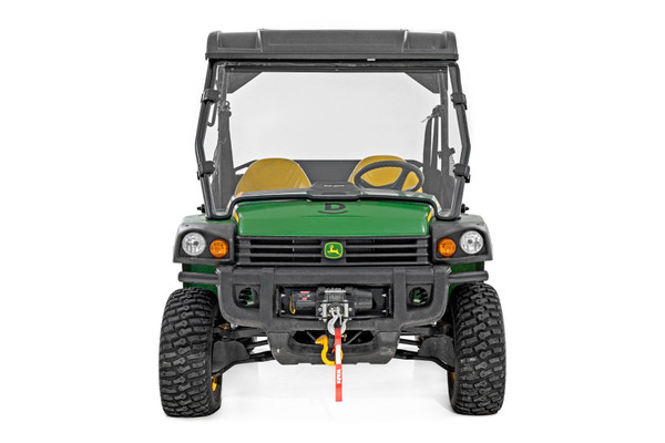 Added Protection and comfortability. Protect the occupants of your John Deere Gator from off-road hazards such as rocks, branches, and other debris with Rough Country's Scratch-Resistant Windshields. UTV Windshields offer a clear visual of the trail ahead and allow for a much more comfortable outing!\
High-Quality Polycarbonate Construction. Rough Country UTV windshields are constructed from thick polycarbonate material that is precision cut for a perfect fit. The polycarbonate material provides an ideal combination of clarity, flexibility, durability that outperforms glass, acrylic, and other windshield materials.\
Durable Scratch and UV Resistance. Each windshield is not only constructed from thick polycarbonate material but enhanced by a secondary AR2 hard-coating process. This process completely coats the windshield with a hardened, scratch-resistant barrier. This treatment also provides the additional benefit of UV protection.\
Easy Installation. With a simple strap-on installation process, installing a Rough Country windshield couldn't be easier. Within 15 ΓÇô 30 mins you can be ready to hit the trails.\
Limited-Lifetime Replacement Warranty. Rough Country's Scratch-Resistant Windshields are backed with a limited lifetime replacement warranty towards manufacturer defects. As such, the product is protected from structural and workmanship damage after the date of purchase. With our industry-leading warranty give yourself peace of mind when using Rough Country's Suspension products!