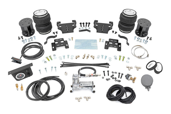 Ideal Leveling: Is your truck your workhorse? The main attraction of a pickup is the ability to haul and tow as needed. However, due to the weight in the bed or the condition of the rear leaf springs, your vehicle may become un-level under load. At Rough Country, we've designed a solution to eliminate these concerns. Introducing Rough Country's Rear Air Spring Kit.Heavy-Duty Construction: Rough Country's Rear Air Spring Kit includes two high-quality, double convoluted air bags, reinforced with durable powder-coated steel brackets and DOT-approved airlines. Whether you're towing a trailer or hauling heavy loads, this kit helps ensure your vehicle remains level, alleviating the strain on your trailer's tongue weight. The kit features 1/4" push-to-connect air fittings for easy installation, along with all necessary bracketry for a secure fit. Rough Country's Air Spring Kit supports up to 5,000 lbs of load, minimizing sway and preventing bottoming out while braking and steering.Easy Installation: Quick and simple setup for immediate use. Rough Country's kit can be installed at home with standard tools in just 5-6 hours, ensuring minimal downtime and fast, hassle-free installation.Onboard Air Compressor and Wireless Controller: For added convenience, Rough Country offers an optional onboard air compressor and wireless controller to easily adjust your air spring kit on the go. Control air pressure at the push of a button from the comfort of your vehicle.Reliable Warranty Coverage: Rough Country's Rear Air Spring Kit includes a limited lifetime warranty on the air springs and a two-year replacement warranty on the compressor, offering lasting protection against manufacturer defects. This industry-leading coverage ensures confidence in both quality and durability, so you can count on Rough Country to keep your truck performing at its best.