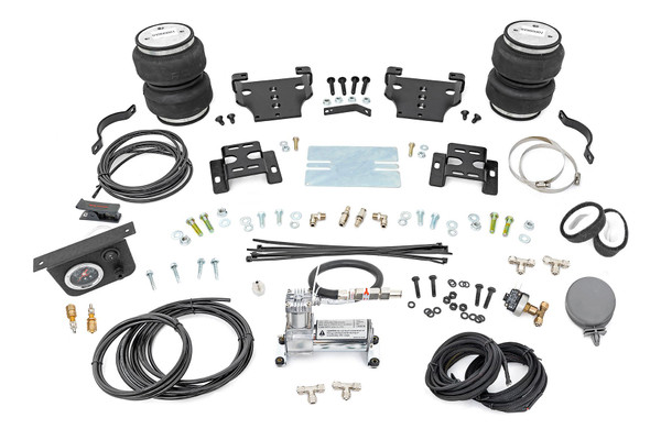 Ideal Leveling: Is your truck your workhorse? The main attraction of a pickup is the ability to haul and tow as needed. However, due to the weight in the bed or the condition of the rear leaf springs, your vehicle may become un-level under load. At Rough Country, we've designed a solution to eliminate these concerns. Introducing Rough Country's Rear Air Spring Kit.Heavy-Duty Construction: Rough Country's Rear Air Spring Kit includes two high-quality, double convoluted air bags, reinforced with durable powder-coated steel brackets and DOT-approved airlines. Whether you're towing a trailer or hauling heavy loads, this kit helps ensure your vehicle remains level, alleviating the strain on your trailer's tongue weight. The kit features 1/4" push-to-connect air fittings for easy installation, along with all necessary bracketry for a secure fit. Rough Country's Air Spring Kit supports up to 5,000 lbs of load, minimizing sway and preventing bottoming out while braking and steering.Easy Installation: Quick and simple setup for immediate use. Rough Country's kit can be installed at home with standard tools in just 5-6 hours, ensuring minimal downtime and fast, hassle-free installation.Onboard Air Compressor and Wireless Controller: For added convenience, Rough Country offers an optional onboard air compressor and wireless controller to easily adjust your air spring kit on the go. Control air pressure at the push of a button from the comfort of your vehicle.Reliable Warranty Coverage: Rough Country's Rear Air Spring Kit includes a limited lifetime warranty on the air springs and a two-year replacement warranty on the compressor, offering lasting protection against manufacturer defects. This industry-leading coverage ensures confidence in both quality and durability, so you can count on Rough Country to keep your truck performing at its best.