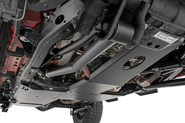 Take to the trails in absolute confidence with Rough CountryΓÇÖs JL Skid Plate Armor Kit. This easy to install, all-inclusive kit is designed to offer total protection for the underside of your Jeep; protecting crucial components such as the gas tank, transfer case, and engine.These 3/16-inch thick plate steel panels are designed to keep sensitive components protected from rocks and debris that could otherwise damage your vehicle. Rough CountryΓÇÖs Skid Plate Armor is designed with recessed mounting points to ensure you never snag a bolt-head when crossing over tough terrain.Each JL Skid Plate kit features durable, protective panels designed to fortify the engine oil pan and transmission, transfer case, and (optional) gas tank giving you unbridled protection against off-road obstacles.This easy to install skid plate system features a 100% bolt-on installation process with no cutting or drilling required. Rough CountryΓÇÖs gas tank skid installs directly over the factory gas tank skid for easy assembly and a double layer of protection. The engine skid plate features an oil-drain access so you can easily change oil without removing your additional protection. Obliterate off-road obstacles with ease knowing that Rough Country has you covered!