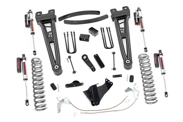 Compliment your 08-10 Ford F-250/350's aggressive, good looks with Rough Country's 6-inch Radius Arm Lift Kit. Rough Country's 6-inch Lift Kit was engineered to retain the F-250/350's impressive factory specs while bumping up performance and durability where it's needed most. The result is an aggressive, lifted beast with a mean profile and balanced on and off-road ride quality. When changing a vehicle's suspension, the key to preserving ride quality is in keeping the geometry of all suspension components as close to their factory angles as possible. Rough Country's new 6-inch Radius Arm Suspension Lift features a set of ultra-durable Radius Arms, precision fit to bolt right into the factory mounts for an easier install and a more factory-like angle. At 27lbs each, these beefy, upgraded Radius Arms dwarf stock equipment while and feature durable durable rubber bushings for maximum vibration absorption. This all-inclusive kit also features an adjustable alignment cam at the axle to allow caster adjustment as well as a track bar relocation bracket and a drop pitman arm. A full set of Vertex Adjustable Reservoir Shocks┬áprovide a truly balanced ride quality for on and off-road use - prefect for daily drivers. This kit also ships with a set of durable, lifted coil springs and brake line relocation brackets. This innovative kit design features a 100% bolt-on installation process that is lightning fast compared to other kits this size. Save time and money with no need for cutting, drilling, or other complicated procedures. Rough Country's 6-inch Radius Arm Lift Kit is backed by our Lifetime Replacement Warranty.