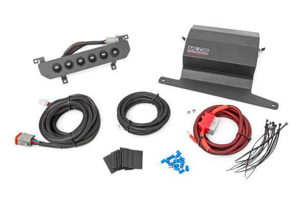 Take command of your electronic devices with Rough CountryΓÇÖs MLC-6 Multiple Light Controller for Jeep Wrangler JL. This easy and reliable electrical upgrade allows you to control six auxiliary LED lights or electrical devices with the push of a button. Each kit features a power distribution block, 6-row switch hub, mounting hardware, and high-temperature, abrasion resistant wiring cables.Rough CountryΓÇÖs MLC-6 is a professional quality power distribution system and switchboard for Jeep JL models, allowing you to add professional control for your electronic devices in an easy-to-install system that doesnΓÇÖt gut your dashboard or force you to splice into factory wiring. This plug-and-play system uses an in-line fused relay allowing you to safely connect up to 6 devices to one of the 6 interior switches with no mess and no fuss.The MLC-6 Power Distribution Block features an integrated LVCO (Low-Voltage Cut-Off) Circuit that detects battery voltage and will cut-off each accessory when the battery falls below operating voltage, ensuring you always have enough power to turn over your engine. This distribution system also features a 12-position terminal block for hooking up accessories, six plug-in style 40-amp cube relays, and 6 ATO style 30-amp automotive fuses for superior power and protection. Includes a 1-year mechanical warranty and 1-year electrical warranty!