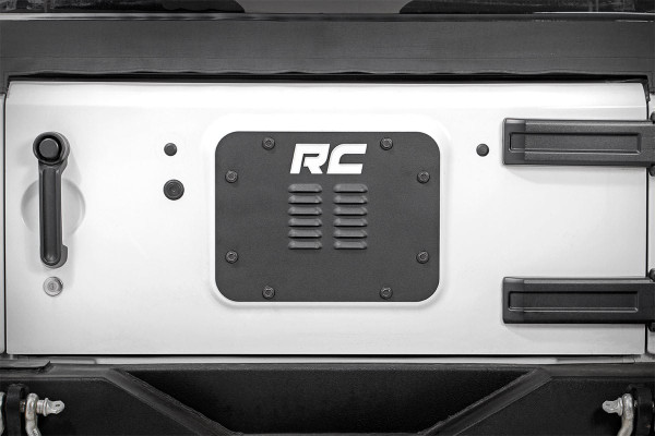 Delete your spare tire and dress up the back of your JK with Rough CountryΓÇÖs Spare Tire Delete Vent Cover for Jeep JK! This stylish, louvered cover fits perfectly over your JKΓÇÖs rear vent, drastically improving the looks of your Jeep after removing the spare tire and carrier.Buying a 5th tire and wheel gets expensive, and many aftermarket tires and wheels are simply too large to use on a rear tire carrier. Delete your spare tire and improve the look of this now visible area with this easy to install product.Each Vent Cover is laser-cut and powdercoated black for a precise fit and a long lasting lifespan of good looks. Includes a lifetime replacement warranty!