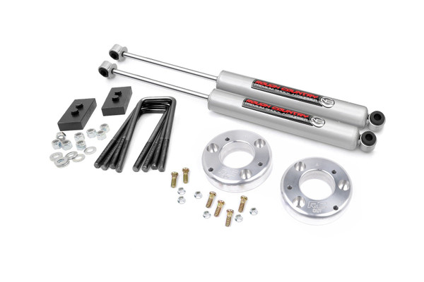 Lift your F-150 in style with Rough Country's sleek and durable 2" Lift Kit. This innovative kit combines great looks and exceptional strength, offering 2 inches of lift for improved off-road performance. Crafted from premium T6061 Billet Aluminum, this spacer ensures top-tier durability, resisting rust and corrosion even in harsh weather conditions.Effortless Bolt-On Installation: The easy-to-install, 100% bolt-on design makes upgrading your ride a breeze. No cutting or welding required - install in no time using common tools!Preserves Factory Ride Quality: Maintain the smooth, factory ride you love while gaining added height for improved clearance and off-road performance.Boosts Ground Clearance: Perfect for off-road enthusiasts, this kit increases ground clearance, giving you the ability to tackle tougher terrain and fit larger tires.Preserves Factory Rake: Maintain your vehicle's original stance and appearance, with no modification needed to the rear height.No Strut Disassembly Required: Save time with a simple installation that doesn't require disassembling your factory strut assembly.Includes Rough Country's N3 Rear Shocks: This kit comes complete with Rough Country's N3 rear shocks for enhanced ride quality and improved suspension performance. These premium shocks are engineered to deliver superior damping, increased stability, and all-terrain comfort, making your F-150 ready for any adventure right out of the box.Rough Country's specially designed spacer pattern ensures proper clearance between the upper control arm and the strut, with a unique driver and passenger side design. This kit allows you to run up to 33-inch tires, giving your truck an aggressive, off-road-ready look.