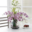 Faux Purple Phalaenopsis with Twigs and Greens in Glass Cylinder