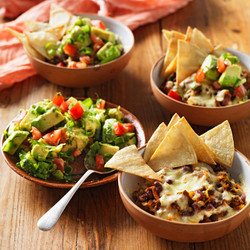 Nachos topped with beef or chicken plus black beans, guacamole, sour cream & lettuce