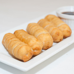 Fried Tequeños (Cheese Pastry Fingers) served with tomato relish sauce.