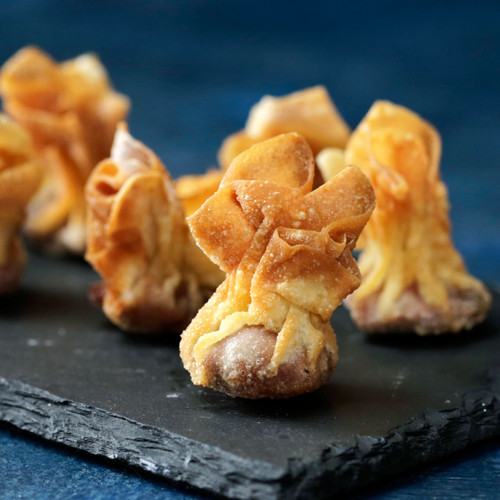 Fried wontons served with Cantonese sauce and sesame seeds