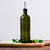 Olive Branch 16oz Recycled Glass Oil or Vinegar Bottle w/ Pour Spout Vintage Green with Olives on Wooden Cutting Board