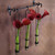 Triple Florence Hanging Pendant Tube Vase with Metal Bar Hanger Angled with Flowers on Wall