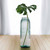 18" Diamond Recycled Glass Container with Monstera Leaf 18" Diamond Recycled Glass Container with Monstera Leaf