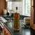 16.9 oz Tuscany Bottle with Cork, Clear with Spicy Infused Olive Oil and Peppers in Kitchen