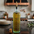 16.9 oz Tuscany Oil or Vinegar Bottle with Gold Spout with Cork on Kitchen Island