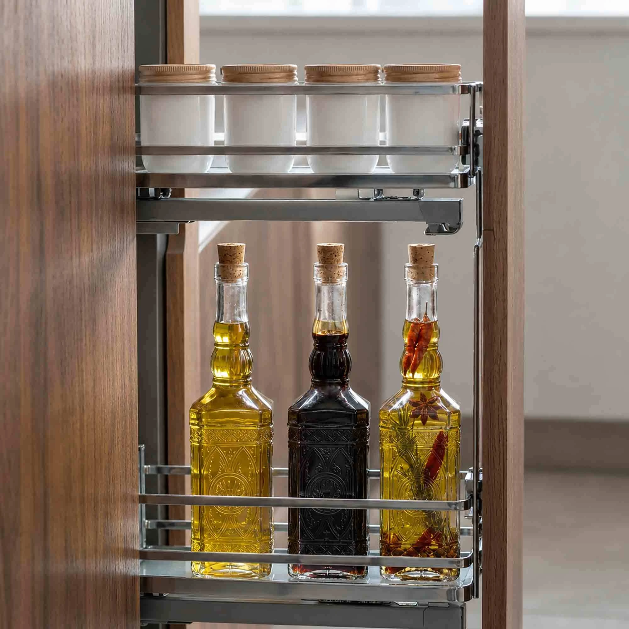 Ornate Clear Glass Bottles with Vegetable Oil, Vinegar, and Infused Olive Oil in Kitchen Slide Out Cabinet