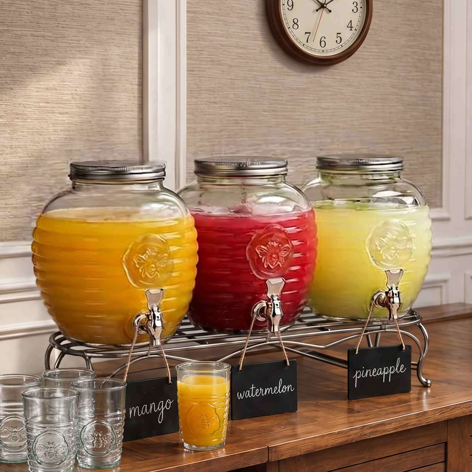 Bee Quenched Glass Drink Dispenser with Fruit Smoothies and Mimosas for Indoor Celebration