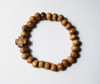Prayer Bracelet with olive wood beads, wooden cross. Will stretch to fit most wrists.