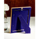 Includes a stand and hook for multiple display options. The back is lined with blue velvet.