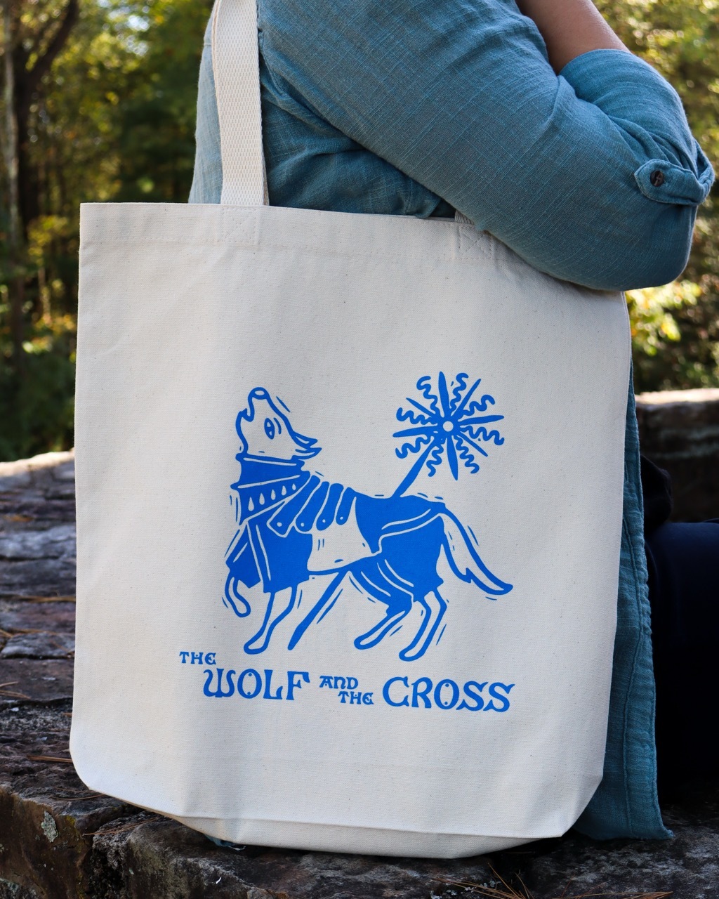 The Wolf and the Cross tote bag