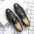 Men's black wave pattern decorated metal on strap slip on dress shoe 06