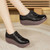 Women's black stretch lace accents slip on rocker bottom shoe 07