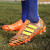 Orange triple stripe label print soccer shoe 09